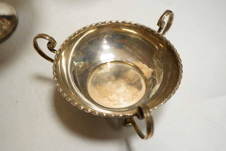 A pair fo George V silver vases, Birmingham,1913, James Woods & Sons, on weighted bases, together with a tazza on weighted base, Birmingham, 1938, William Hutton & Sons and a pair of bonbon dishes, Sheffield, 1910, Walke